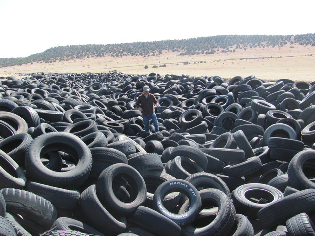 A settlement has been reached to clean up an ocean of illegally dumped tires.