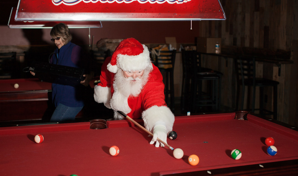 Santa Claus playing pool