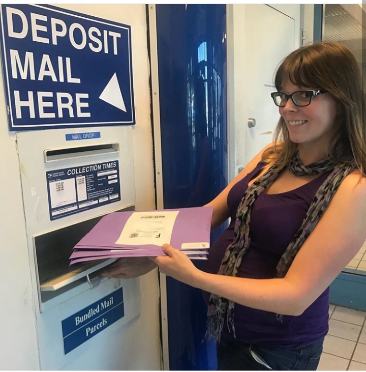 Melanie Unruh depositing mail