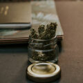 Close-Up Photo of Kush On Glass Container
